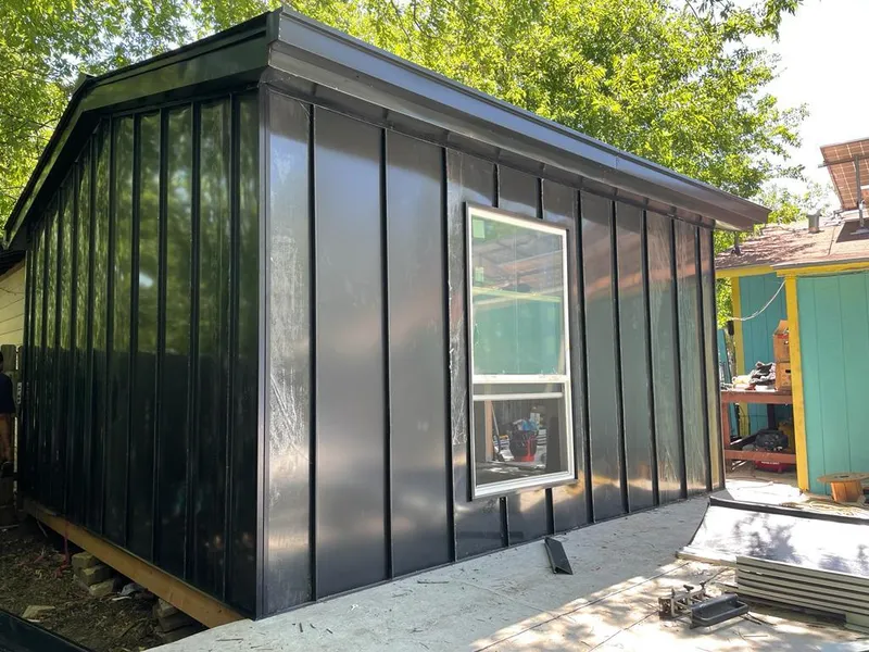 Black standing seam metal wall panels for Metal Roof Installation in Winterville